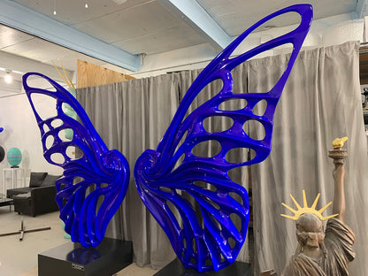 Name: Dream Machine – Blue Medium: Painted Fiberglass Sculpture with stainless steel Base. Size: 13’ x 4’ x 9’ ( Wings + Base). Signed: Hand-Signed. Edition: 1 of 6 Variations. Year: 2019