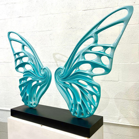 Name: Dream Machine - Tiffany Blue. (Coffee Table Size) Medium: Volcanic stone resin mix / Concrete base Edition: 8 Size: (wings + base) 28”h x 42”w x 9”