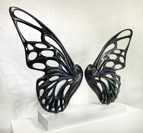 Name: Dream Machine - Black. (Coffee Table Size) Medium: Volcanic stone resin mix / Concrete base Edition: 8 Size: (wings + base) 28”h x 42”w x 9”