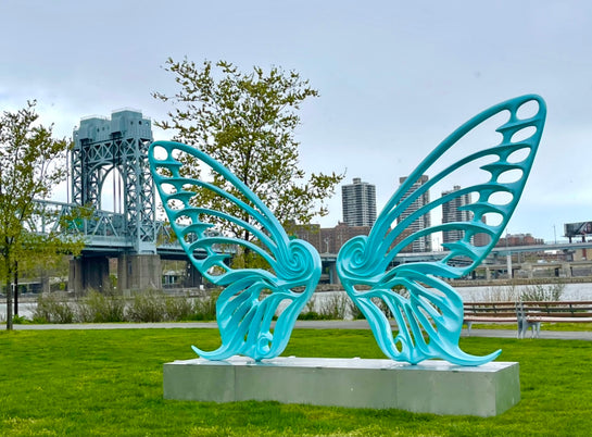 Name: Dream Machine II
 Medium: Painted 
Fiberglass Sculpture with stainless structure and Base.
 Size: 13’ x 4’ x 9’5 ( Wings + Base).
 Year: 2019