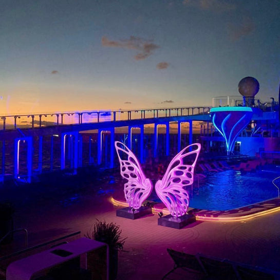 Name: Dream Machine I 
 Medium: Painted 
Fiberglass Sculpture with stainless structure and Base.
 Size: 13’ x 4’ x 9’5 ( Wings + Base).
 Year: 2017
