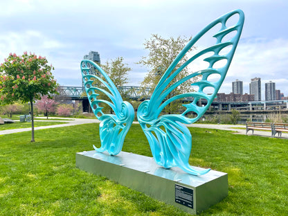 Name: Dream Machine II
 Medium: Painted 
Fiberglass Sculpture with stainless structure and Base.
 Size: 13’ x 4’ x 9’5 ( Wings + Base).
 Year: 2019
