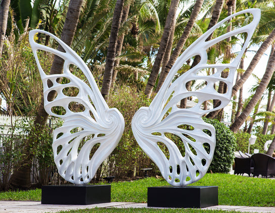 Name: Dream Machine I 
 Medium: Painted 
Fiberglass Sculpture with stainless structure and Base.
 Size: 13’ x 4’ x 9’5 ( Wings + Base).
 Year: 2017