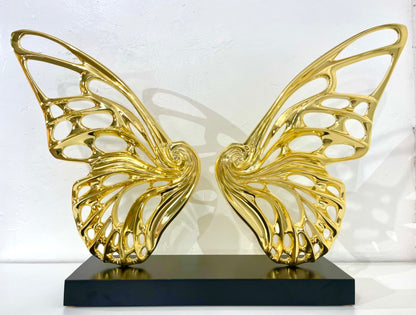 Name: Dream Machine - Golden Chrome. (Coffee Table Size) Medium: Volcanic stone resin mix / Concrete base Edition: 8 Size: (wings + base) 28”h x 42”w x 9”