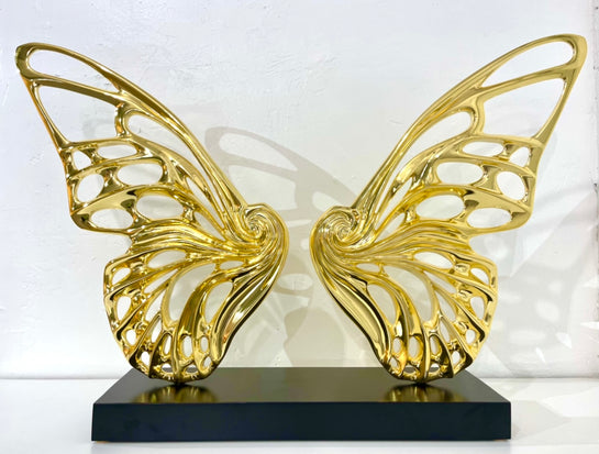 Name: Dream Machine - Golden Chrome. (Coffee Table Size) Medium: Volcanic stone resin mix / Concrete base Edition: 8 Size: (wings + base) 28”h x 42”w x 9”