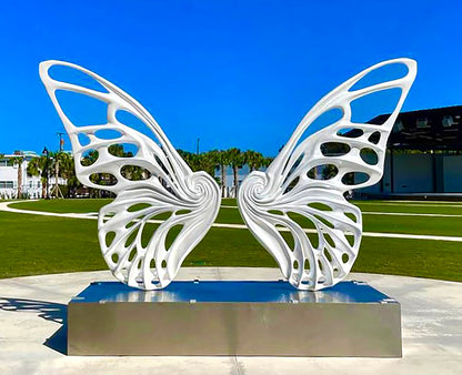Name: Dream Machine I 
 Medium: Painted 
Fiberglass Sculpture with stainless structure and Base.
 Size: 13’ x 4’ x 9’5 ( Wings + Base).
 Year: 2017