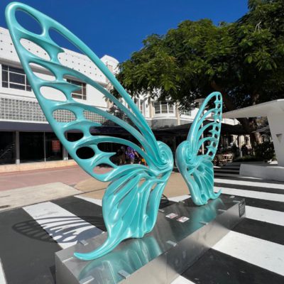 Name: Dream Machine II
 Medium: Painted 
Fiberglass Sculpture with stainless structure and Base.
 Size: 13’ x 4’ x 9’5 ( Wings + Base).
 Year: 2019