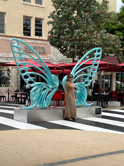 Name: Dream Machine II
 Medium: Painted 
Fiberglass Sculpture with stainless structure and Base.
 Size: 13’ x 4’ x 9’5 ( Wings + Base).
 Year: 2019