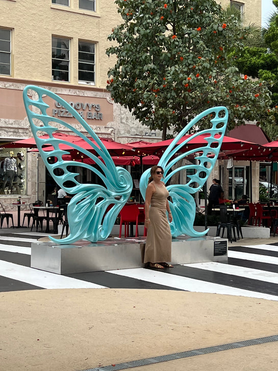 Name: Dream Machine II
 Medium: Painted 
Fiberglass Sculpture with stainless structure and Base.
 Size: 13’ x 4’ x 9’5 ( Wings + Base).
 Year: 2019