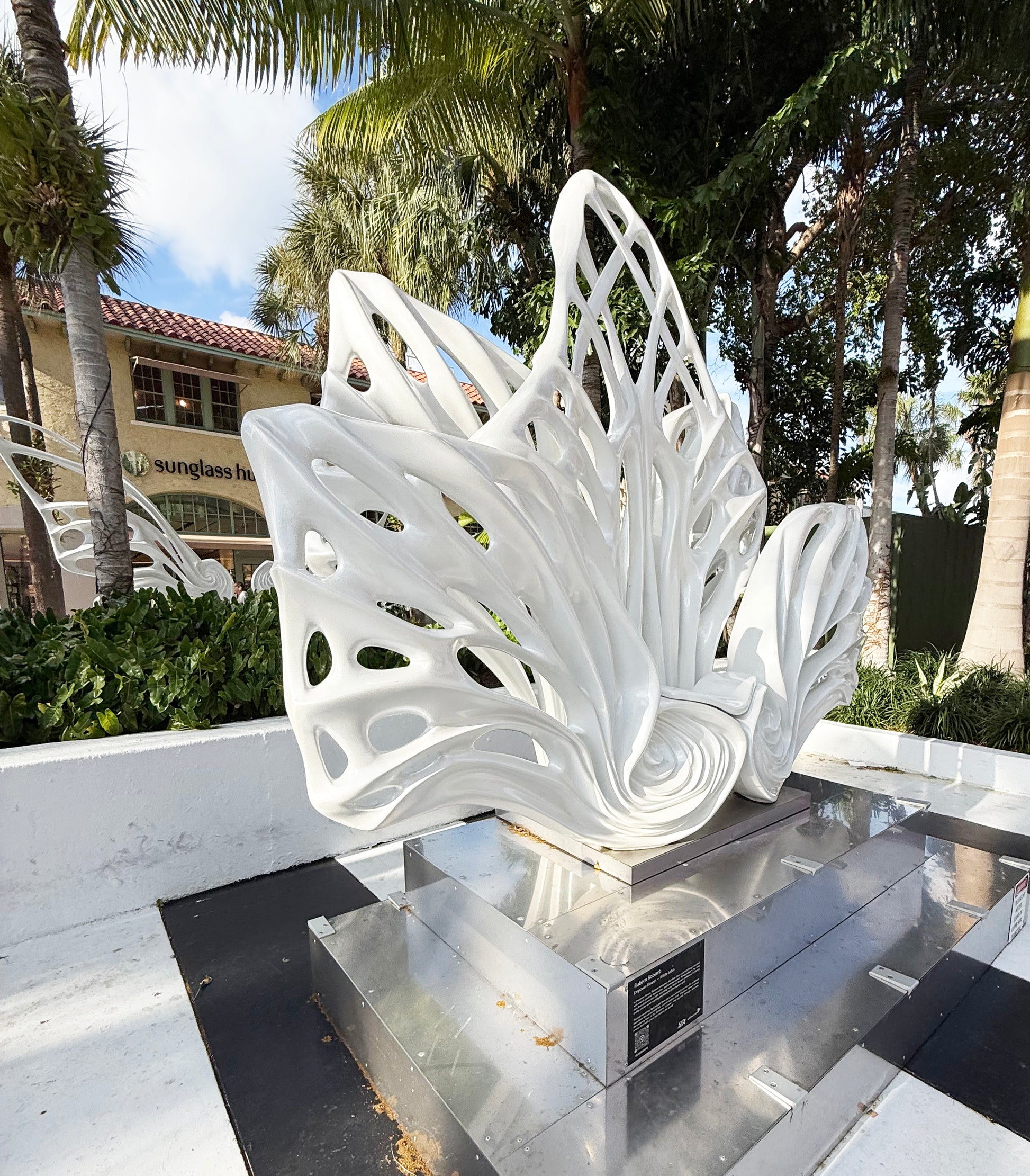Name: Empower Flower
 Size: 10” x 10” x 4”
 Medium: painted Fiber Glass / stainless steel base
 Year : 2020