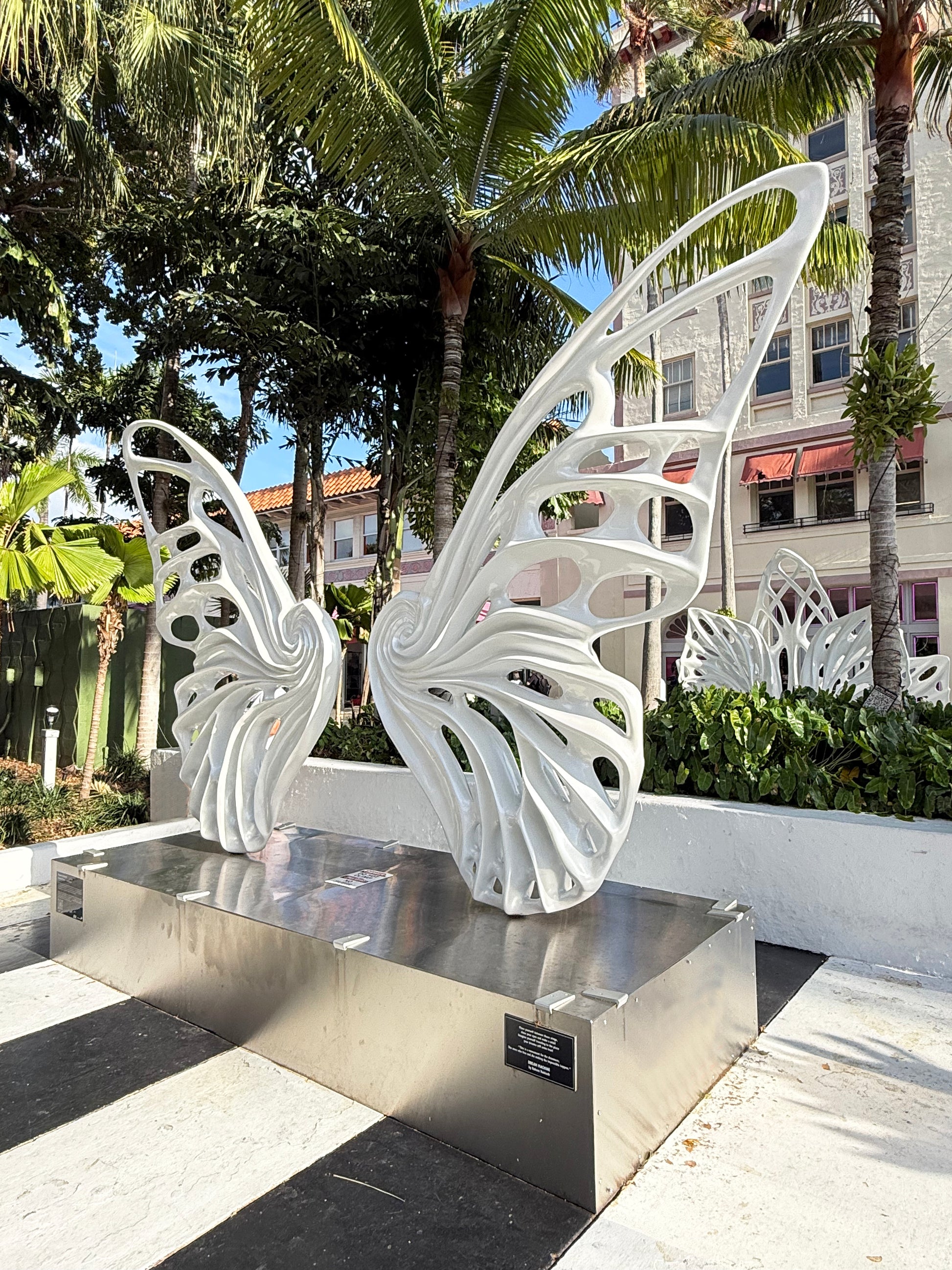 Name: Dream Machine I 
 Medium: Painted 
Fiberglass Sculpture with stainless structure and Base.
 Size: 13’ x 4’ x 9’5 ( Wings + Base).
 Year: 2017